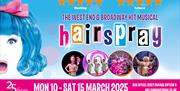 Promotional banner for the West End and Broadway hit musical Hairspray, featuring a bright blue-haired character with a pink bow, alongside bold multi
