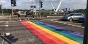 The rainbow crossing outside of the Guildhall, leading to the Peace Bridge.