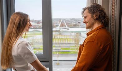 Couple view Peace Bridge from Ebrington Hotel