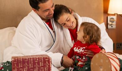 A family in a room at the Everglades Hotel.