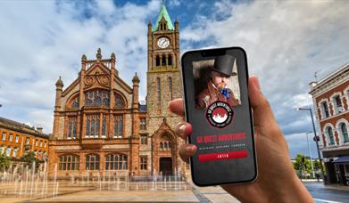 Go Quest Adventure App on phone in Guildhall Square