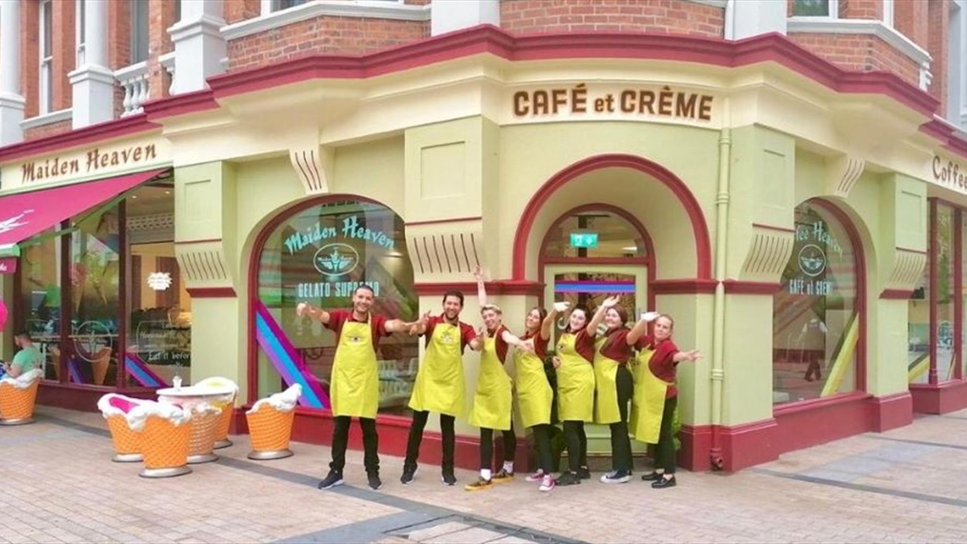 This is a picture of seven members of staff standing together outside the front door of Maiden Heaven.