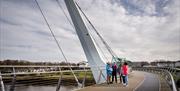 Group on the Peace Bridge in Derry~Londonderry with guide David from Derrie Danders