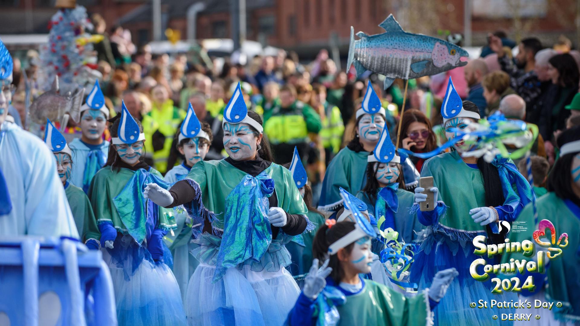 Promotional image of the St. Patrick's Day Spring Carnival Parade, showing a parade in progress.
