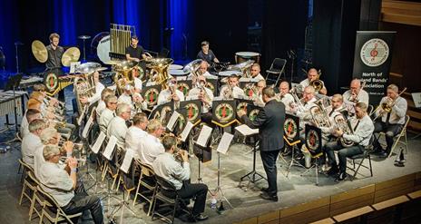The Strabane Brass Band gathered at a performance.