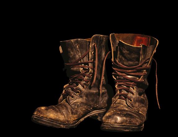 Pair of brown boots against a black background