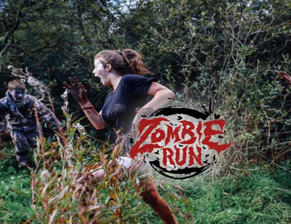 This is promotional poster for the 'Zombie Run' event organised by the Jungle NI. The poster displays participating runners being chased by a person d