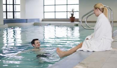 Promotional image for the 'Couples Pamper Package' offer at the White Horse Hotel.
