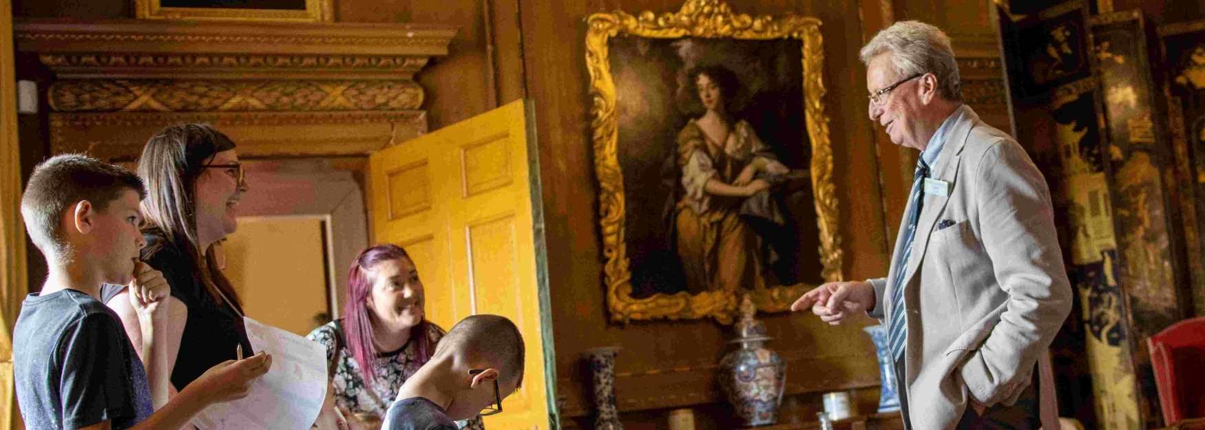 A family being shown around Raby Castle