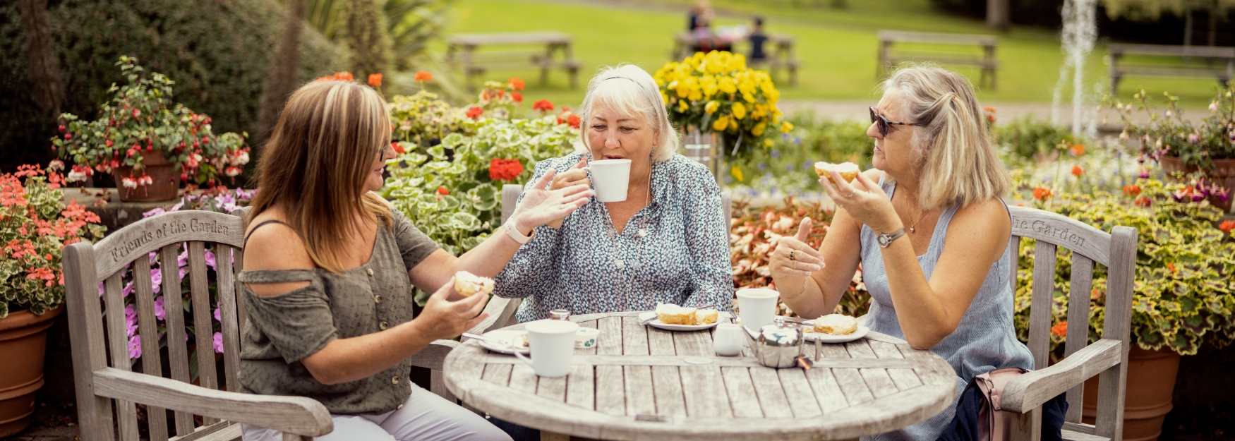 Woman having afternoon tea at the Botanic Gardens in Durham