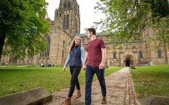 A couple stood in front of Durham Cathedral