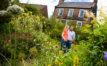 A couple standing outside Crook Hall