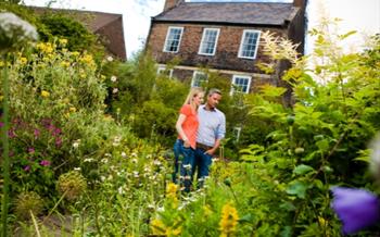 People walking around Crook Hall Gardens