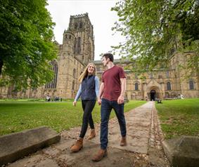 A couple stood in front of Durham Cathedral