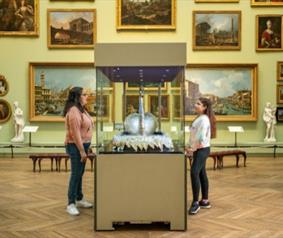 Two people looking at the Silver Swan at The Bowes Museum