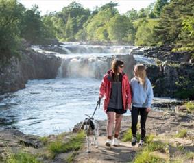 People walking their dog at Low Force
