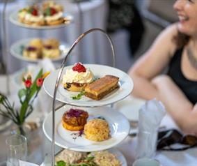 A women enjoying an afternoon tea