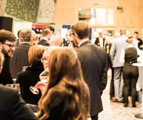 A group of people stood at a conference