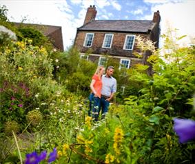 People walking around Crook Hall Gardens