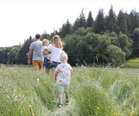 A family walking through the fields