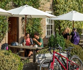 People at the Rose and Crown pub with bikes outside