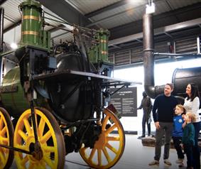 A family looking at a train