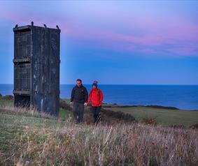 a couple walking on the Heritage Coast footpath at Easington. 