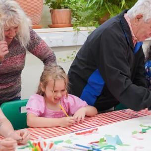 A family enjoying arts and crafts at Ushaw