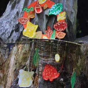 Colourful Autumn prints of hedgehogs, owls, and leaves on a tree at Ushaw