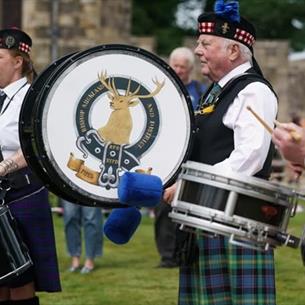 Three drummers performing