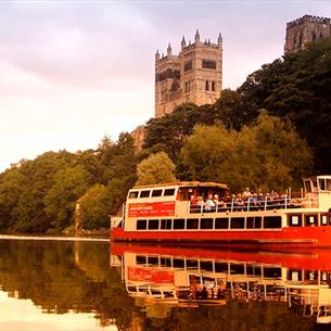 The Prince Bishop River Cruiser sailing on the River Wear in Durham City with the Cathedral in the background