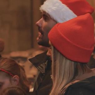 A family attending Carols for All at Durham Cathedral.