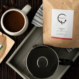 Cacao Brew sachets on a tray with a jug and  a mug