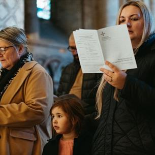 Congregation taking part in the Carols for All service