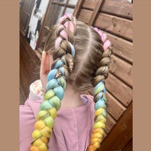 Young girl with coloured hair braids