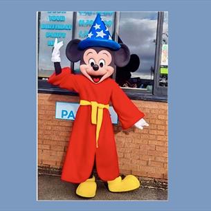 Someone dressed as a Mickey Mouse Wizard