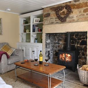 Cosy lounge ideal to sit and relax in front of log burner with a bottle of wine.