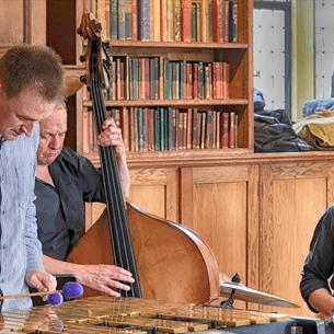 three members of Bishop Auckland jazz playing instruments