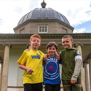 Image of three children outside the Temple of Minerva at Hardwick Park.