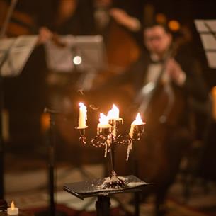 Orchestra playing in candlelight