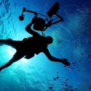 a diver under the surface of the ocean