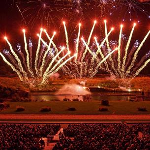 Audience watching the spectacular fireworks display from the arena: Pyromusical 2024
