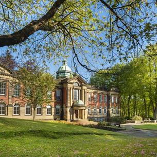 A view of the exterior of Redhills Durham Miners Hall on a sunny day.