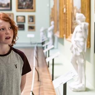 Two children looking at paintings at the Bowes Museum