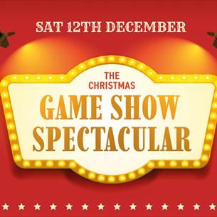 Text reads, 'The Christmas Gameshow Spectacular', illustration of a Game Show title board bordered with lights and stars.  