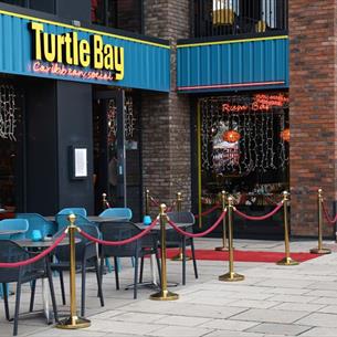 The front exterior of Turtle Bay with outdoor seating