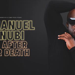 Emmanuel Sonubi wearing sunglasses and posing with one arm behind his head