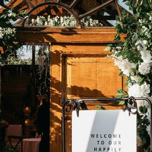 Doorway surrounded by white flowers