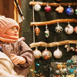 Mother and baby looking at baubles at the Christmas Market, Lumley Castle.