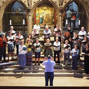 Durham Singers and Northern Spirit Singers performing in a church.